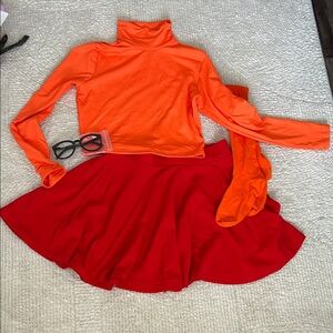 Bright Orange Turtleneck Top with Red Skater Skirt